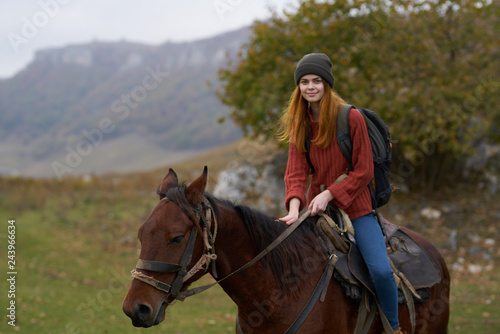 woman riding a horse nature