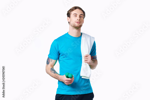 man with a towel with a bottle of water sport fitness