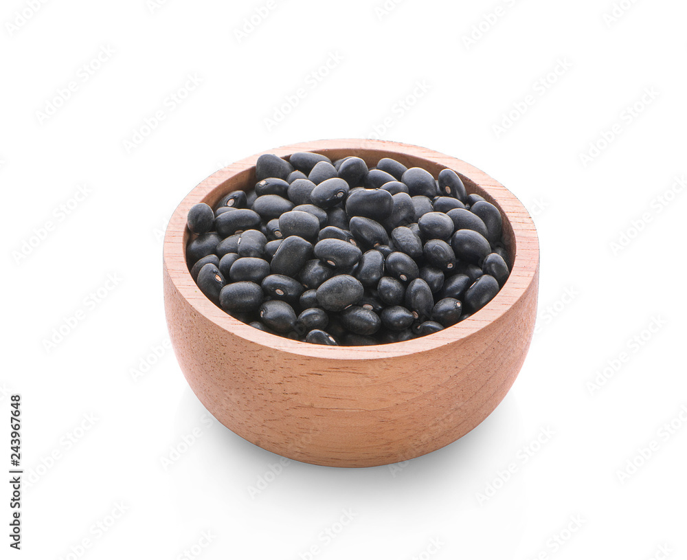 Black beans in wooden spoon isolated on white background Black beans in wooden spoon isolated on white background