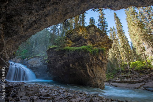 Johnston Canyon cave in Spring season with waterfalls, Johnston Canyon Trail, Alberta, Canada