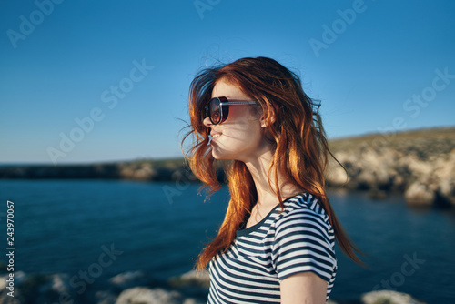 sun woman with glasses sea