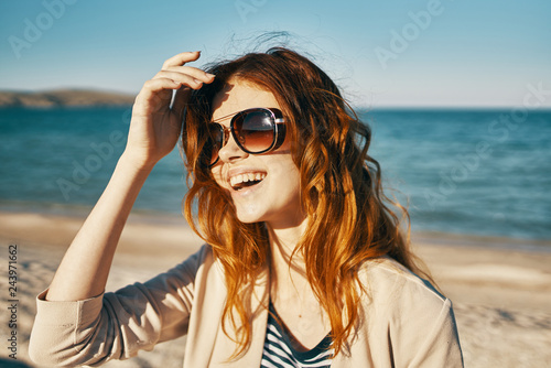 woman with glasses on the beach