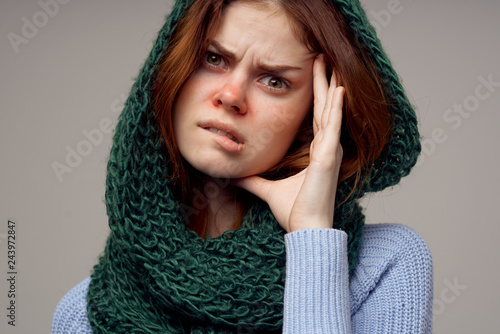 a woman in a scarf has the flu