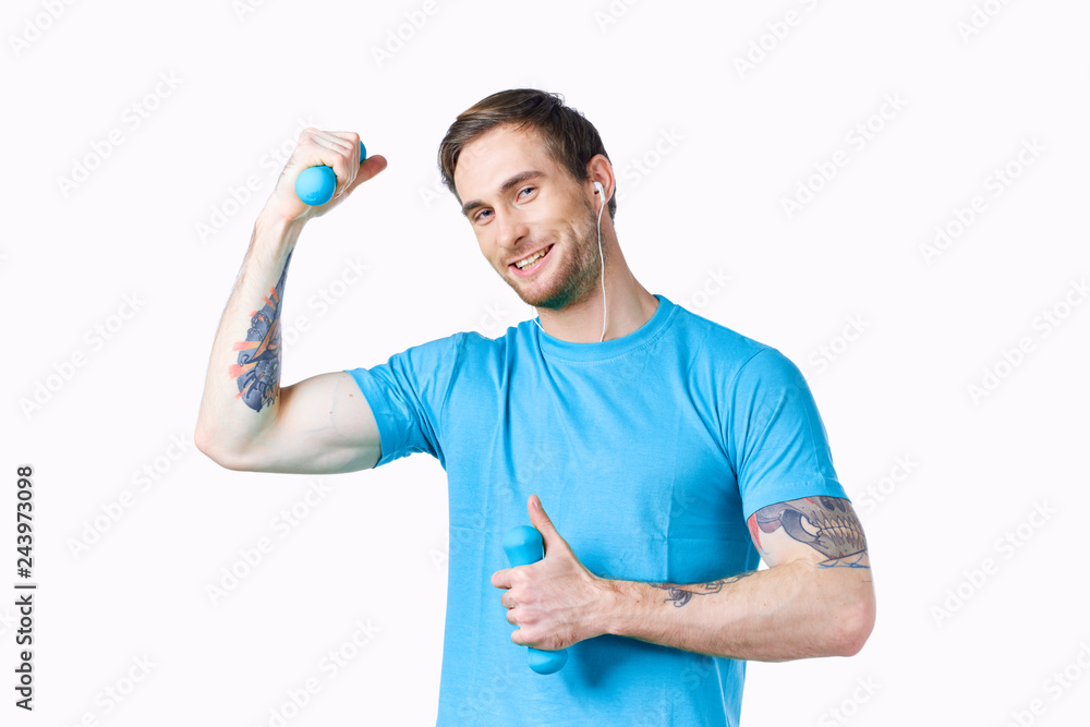 man goes in for sports with dumbbells man goes in for sports with dumbbells