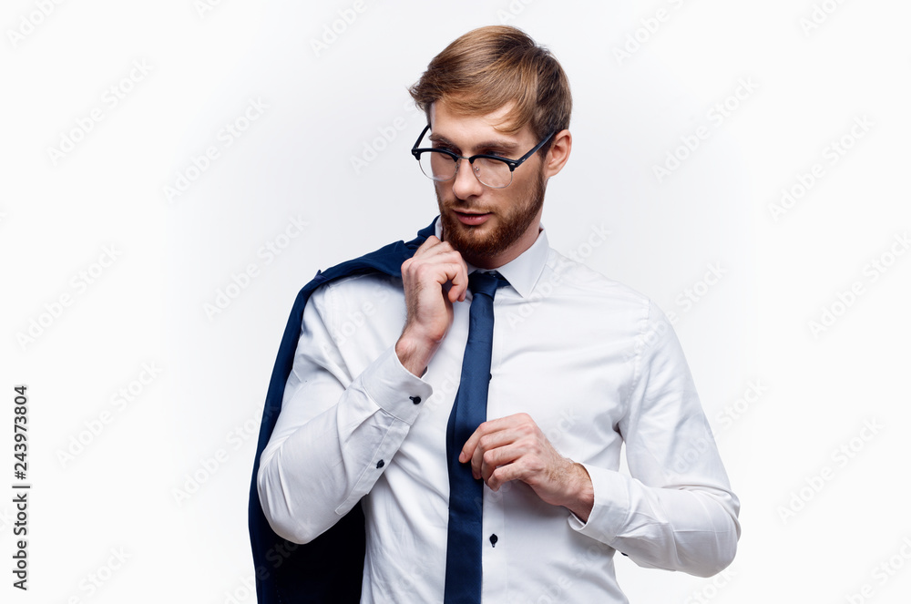 business man in glasses holding a jacket