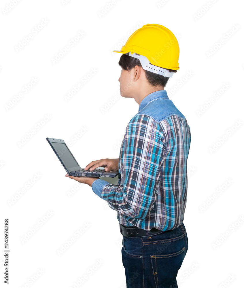 Engineer while holding using Laptop and head wear yellow safety helmet plastic . Concept Work construction on white background Engineer while holding using Laptop and head wear yellow safety helmet plastic . Concept Work construction on white background