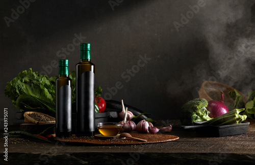 Black oil bottle in dark kitchen background