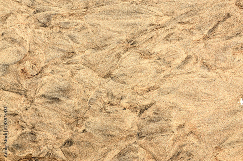 Closeup of sand pattern of a beach, beautiful sand beach