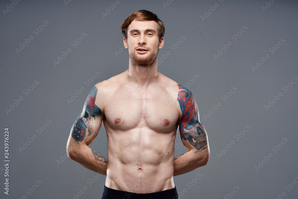 muscular man with tattoo muscular man with tattoo