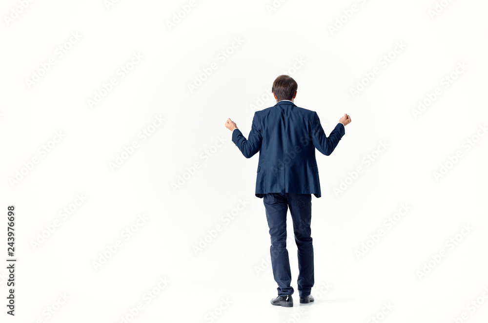 business man stands with his back to the camera on an isolated background business man stands with his back to the camera on an isolated background