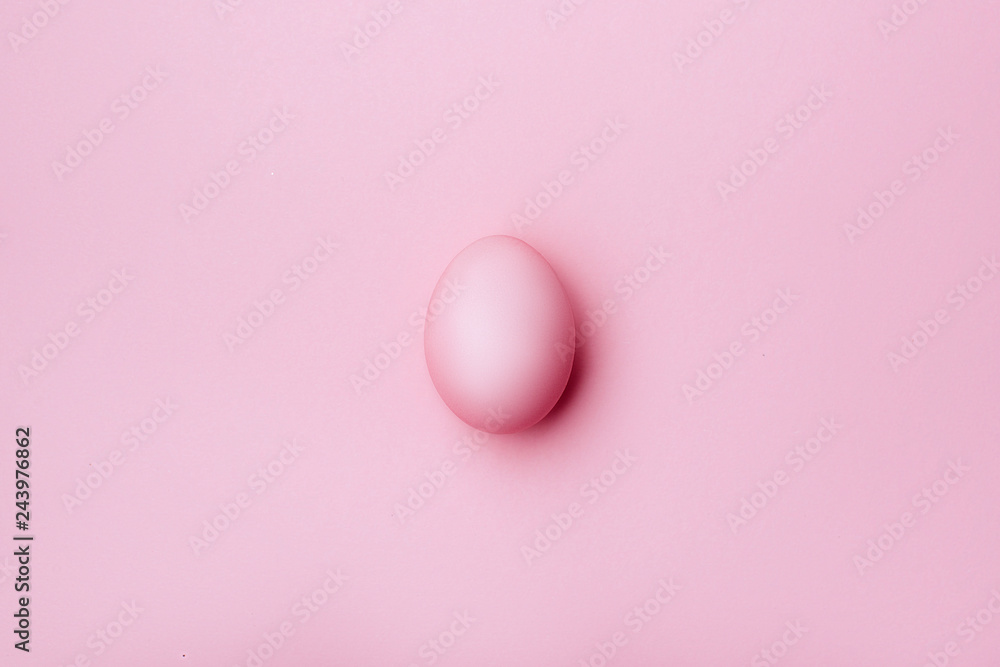 Pink egg on pink background - top view. copy space. Pink egg on pink background - top view. copy space.