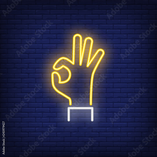 Okay neon sign. Glowing hand in okay gesture on brick wall background. Vector illustration can be used for gesturing, communication, chatting