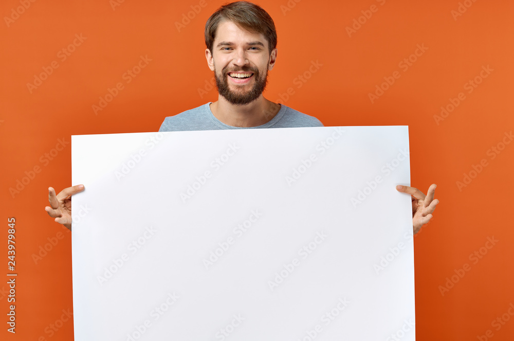 man holding a poster place free man holding a poster place free