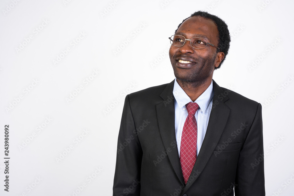 Portrait of happy African businessman with eyeglasses thinking Portrait of happy African businessman with eyeglasses thinking