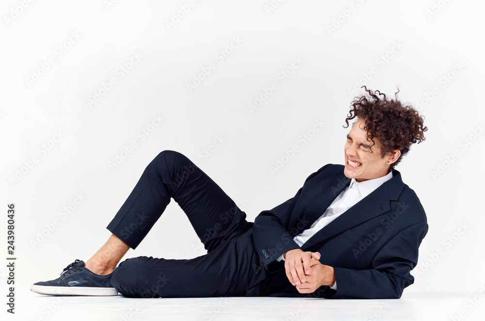 african man lying on fashion isolated background african man lying on fashion isolated background