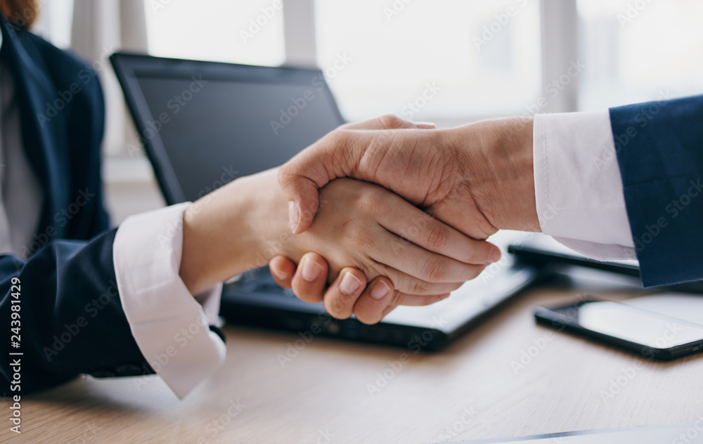 handshake laptop deal business handshake laptop deal business