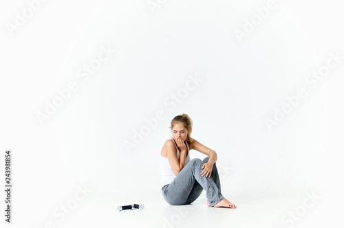 woman sitting on white isolated fitness background