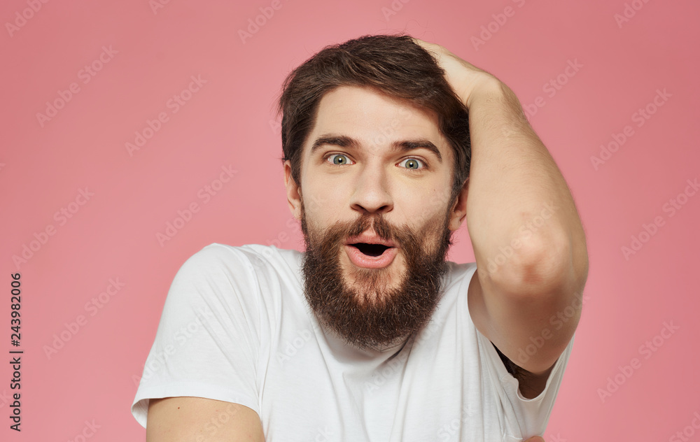 cute male man with a beard on a pink background emotions portrait cute male man with a beard on a pink background emotions portrait