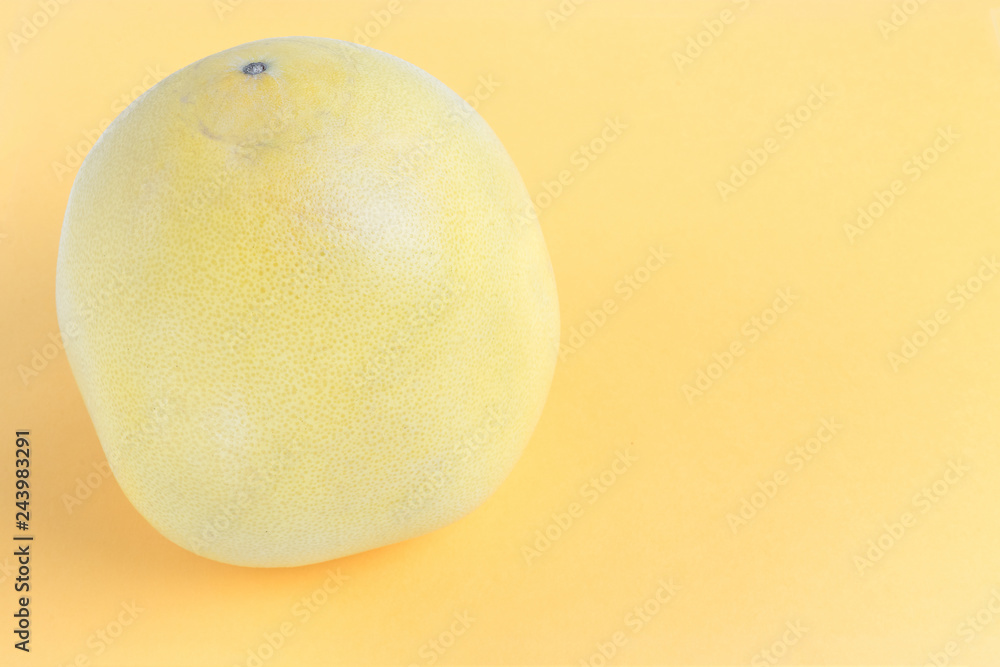 ripe exotic fruit pomelo on yellow background ripe exotic fruit pomelo on yellow background