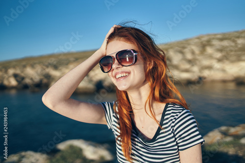 happy woman in sunglasses on the sea