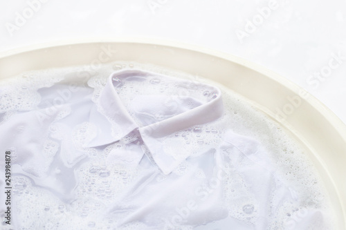 Soak cloth before washing, white shirt