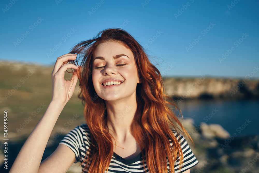 woman smiling with eyes closed nature woman smiling with eyes closed nature