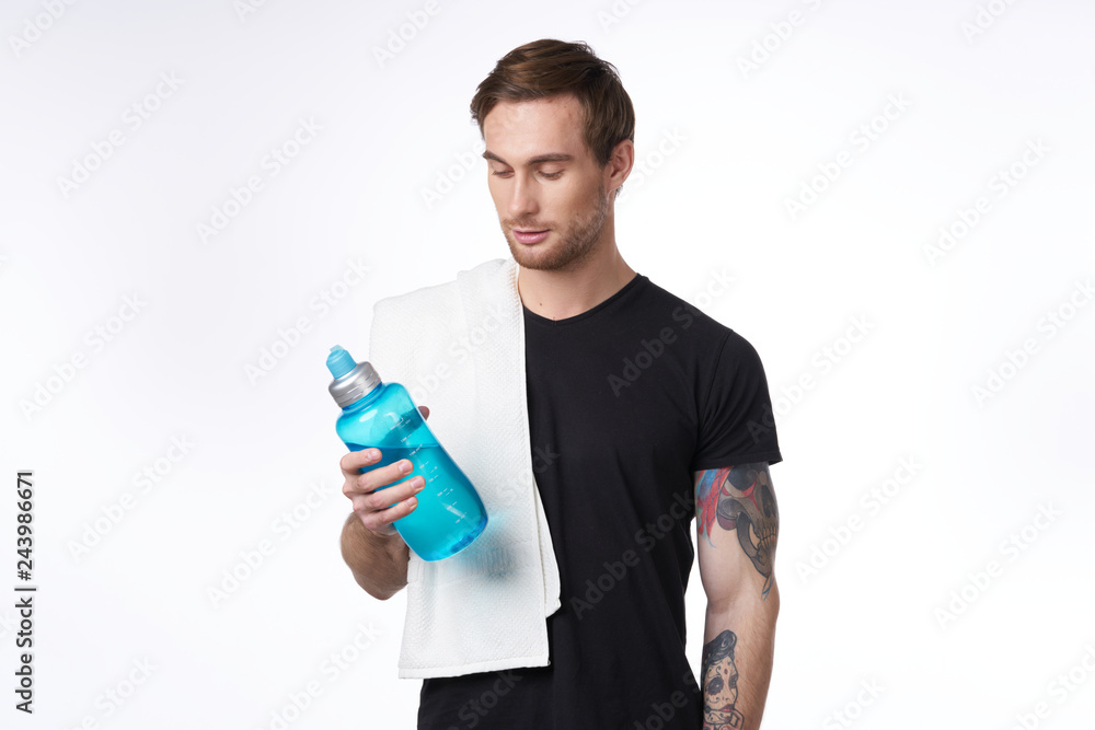 athlete with a towel on his shoulder in hand bottle athlete with a towel on his shoulder in hand bottle