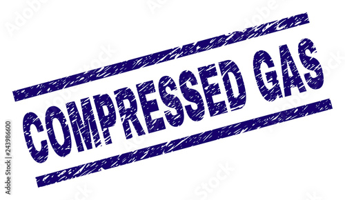 COMPRESSED GAS seal print with distress style. Blue vector rubber print of COMPRESSED GAS tag with retro texture. Text tag is placed between parallel lines.