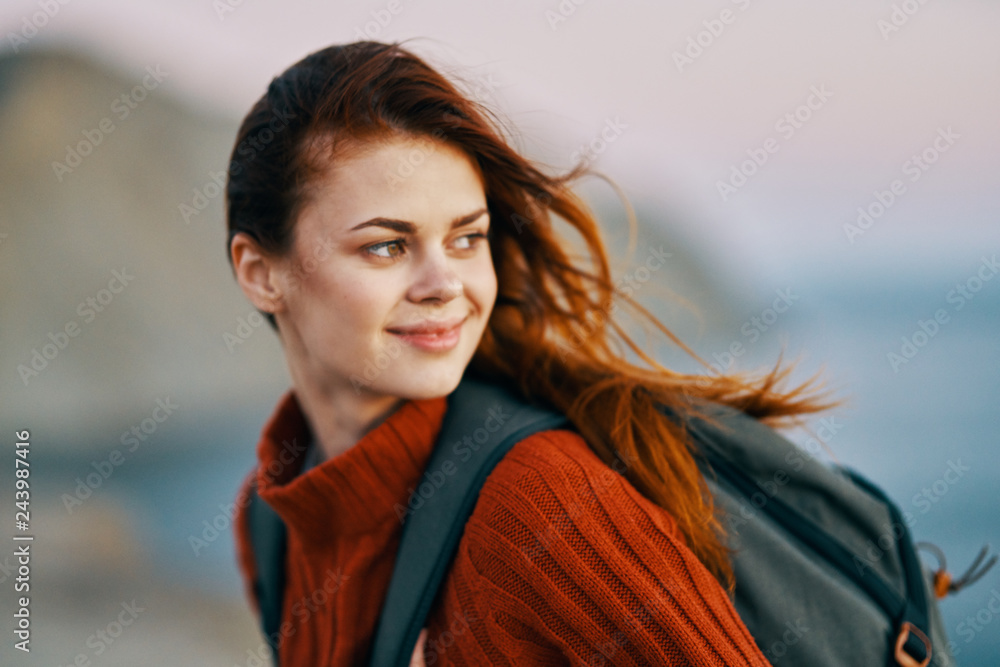 woman with backpack hiking in nature woman with backpack hiking in nature