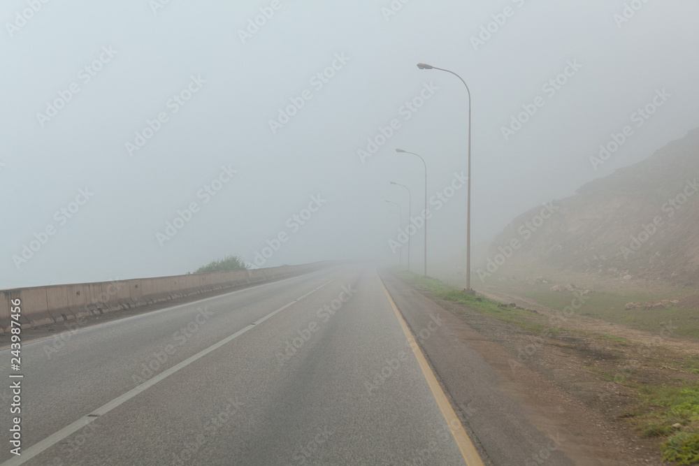 Coastal road near Salalah, Dhofar Province, Oman, during Khareef monsoon season