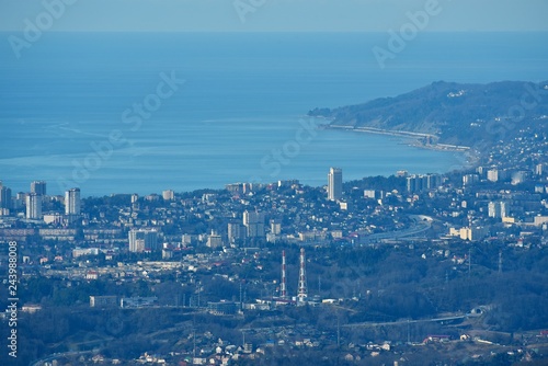 Panorama of the Sochi city from high mountain. Landscape. Blue sea and hills.