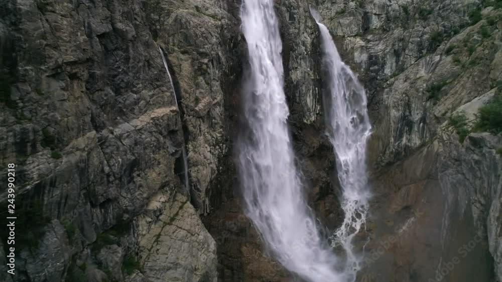slow motion. Flying away from waterfalls in georgia in mountains slow motion. Flying away from waterfalls in georgia in mountains