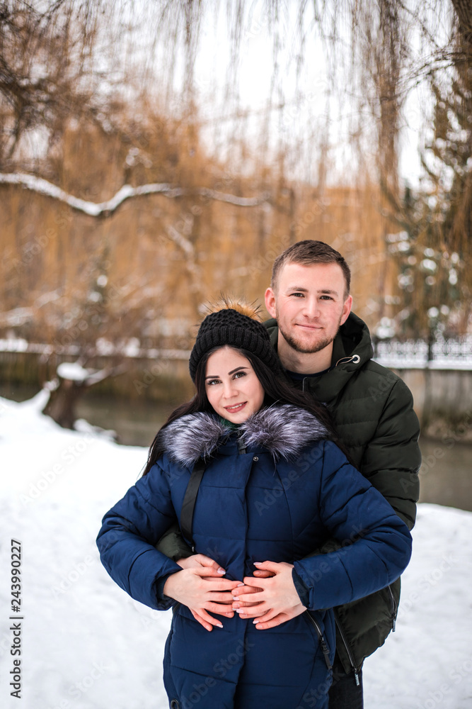 Happy couple have fun in winter park. Happy couple have fun in winter park.