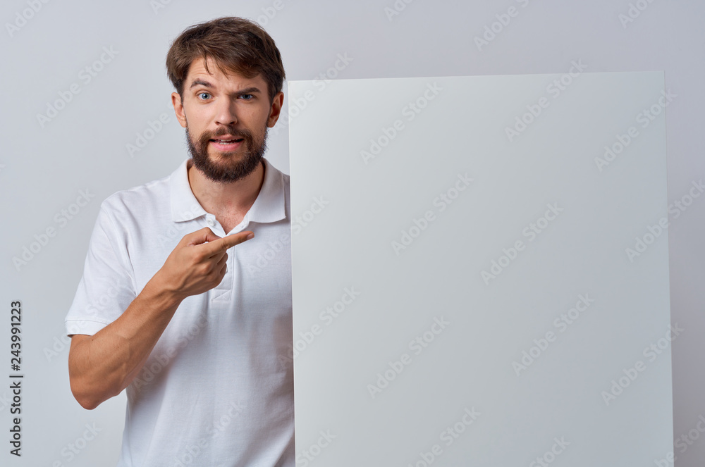a man with a beard shows a finger in the camera holding a background place free a man with a beard shows a finger in the camera holding a background place free