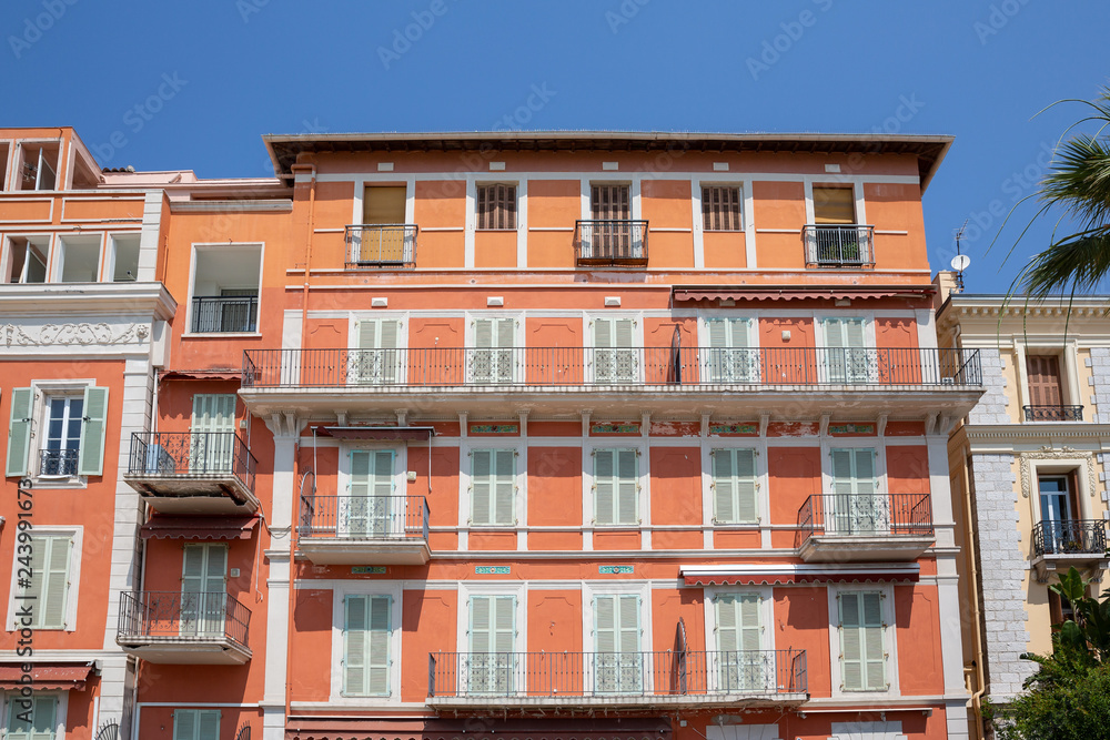 Beautiful balconies and shuttered windows in the mediterranean town of Menton, south of France