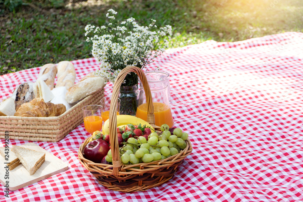 picnic bread crossiant basket with fruit on red white cloth picnic bread crossiant basket with fruit on red white cloth