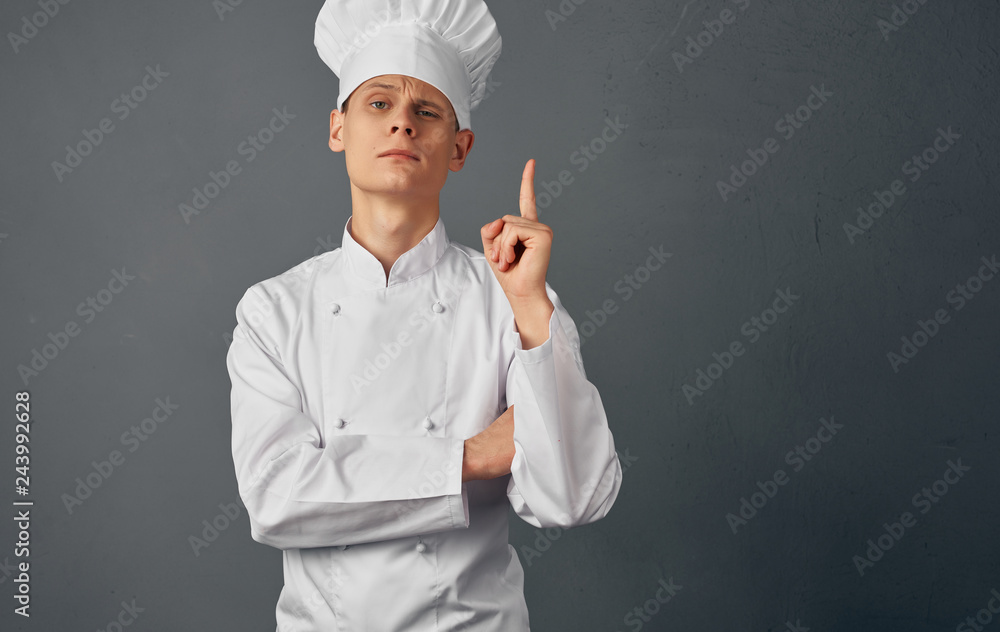 cook in uniform in the kitchen cook in uniform in the kitchen