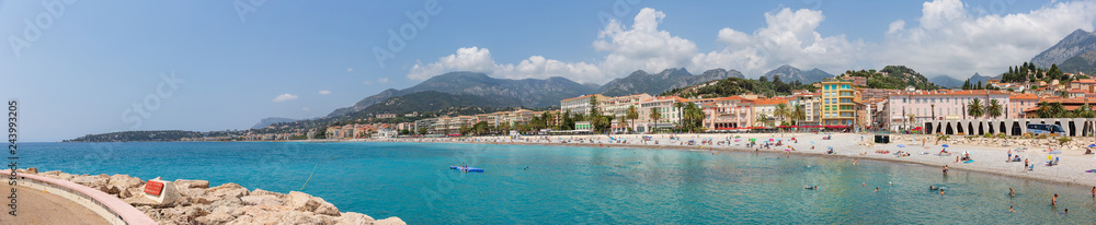 Menton France July 9th 2015 : Panoramic view of tourists and locals enjoying the sun on Menton beach in the south of France
