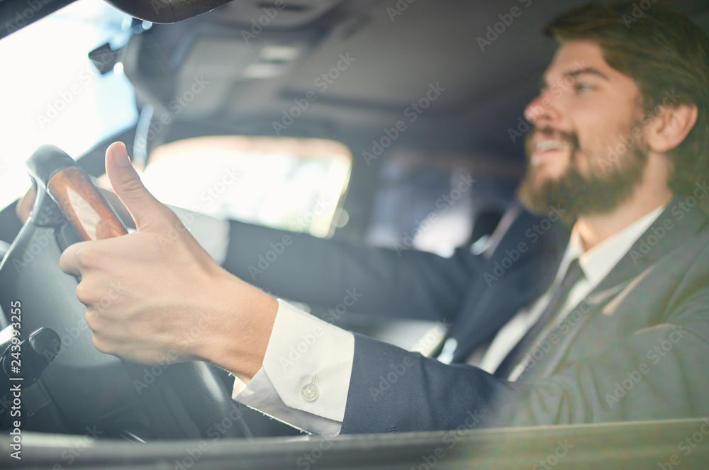 a man with a beard is driving a car a man with a beard is driving a car