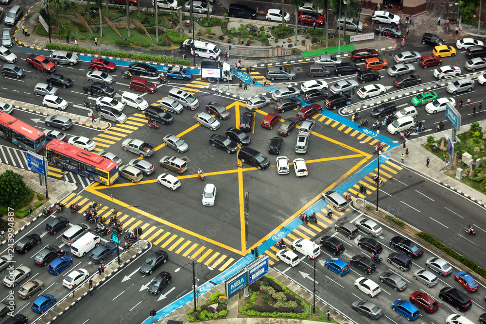 Aerial view looking down onto very busy intersection with heavy traffic