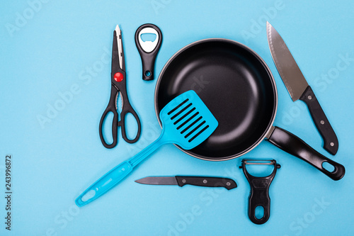 Canvastavla Close up picture of group of kitchen utensils with copyspace on blue background