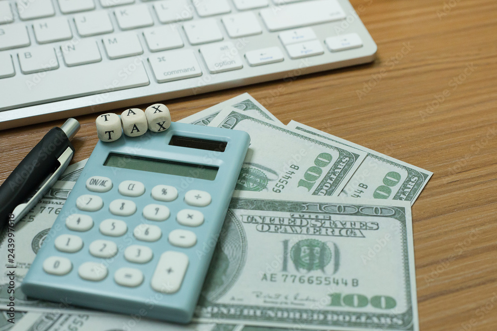 Tax wooden cubic on work table for business content. Tax wooden cubic on work table for business content.