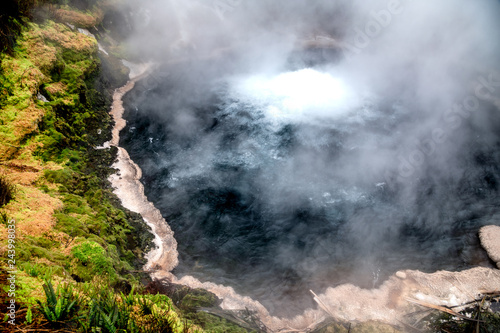 Suphur Crater with smoke and vegetation © jovannig