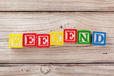 Wooden toy Blocks with the text: weekend