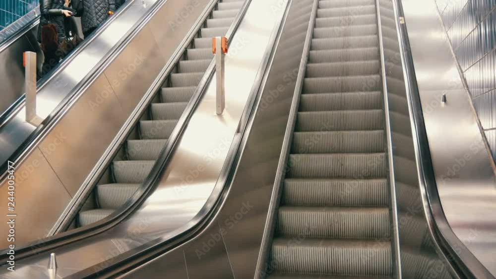 Large modern staircase escalator rides the subway up Large modern staircase escalator rides the subway up
