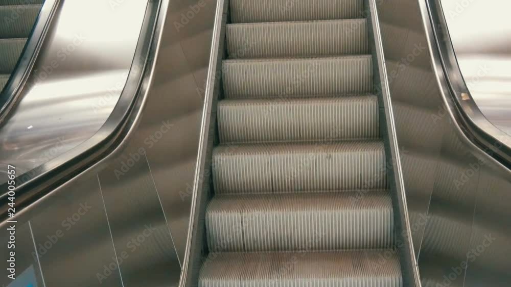 Large modern staircase escalator rides the subway up Large modern staircase escalator rides the subway up