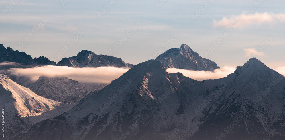 view of mountains at sunset with clouds