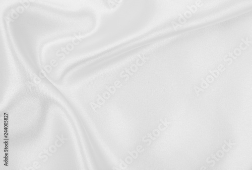 Smooth elegant white silk or satin luxury cloth texture as wedding background. Luxurious background design