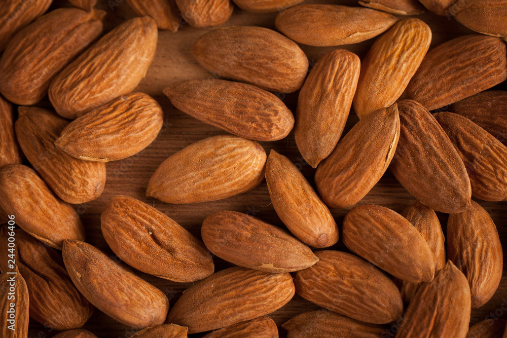 mix of nuts on a wooden table mix of nuts on a wooden table