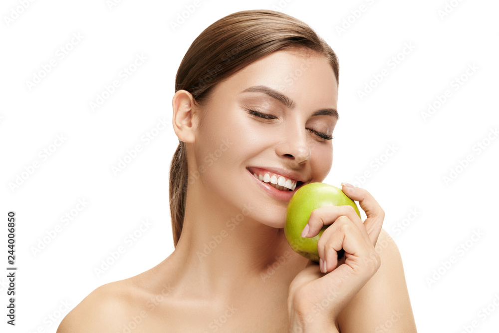 The portrait of attractive caucasian smiling woman isolated on white studio background with green apple fruits. The beauty, care, skin, treatment, health, spa, cosmetic and advertising concept The portrait of attractive caucasian smiling woman isolated on white studio background with green apple fruits. The beauty, care, skin, treatment, health, spa, cosmetic and advertising concept